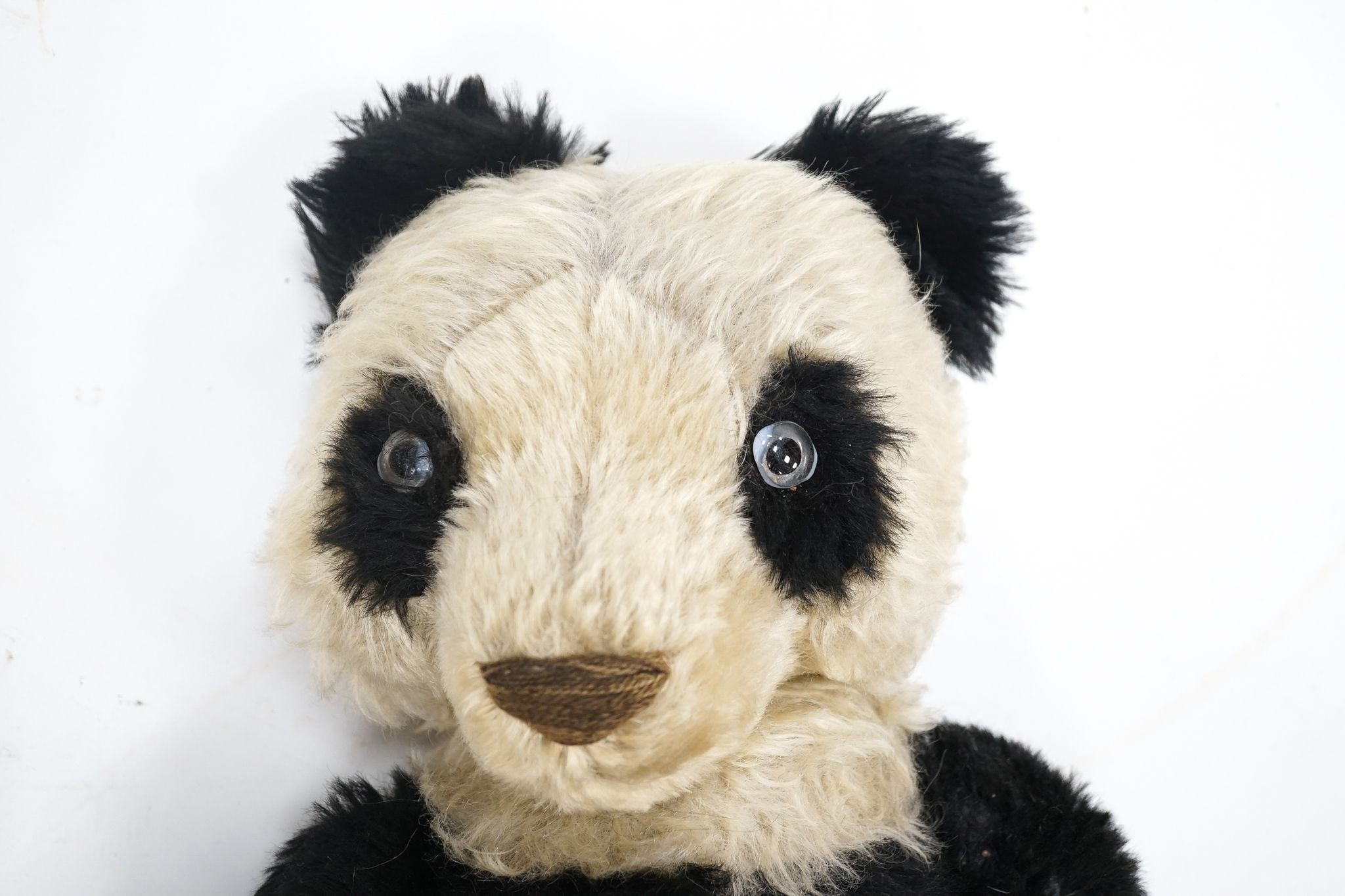 A Merrythought Panda 1930's Label Reg. Design, very good condition, slight thinning right side of tummy, 25in.